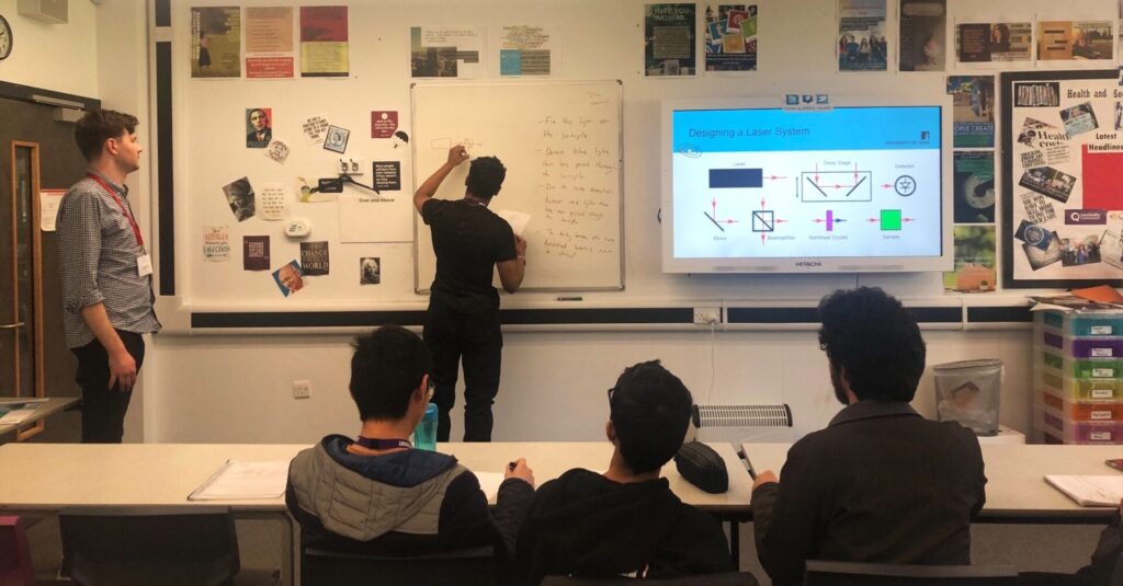 Thomas Gill at Roundhay School, working with students on the designing a laser system activity