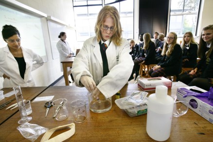 Photograph of children running an experiment 