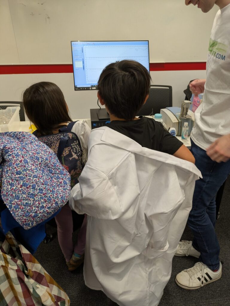 Children engaging with the spectroscopy demo.